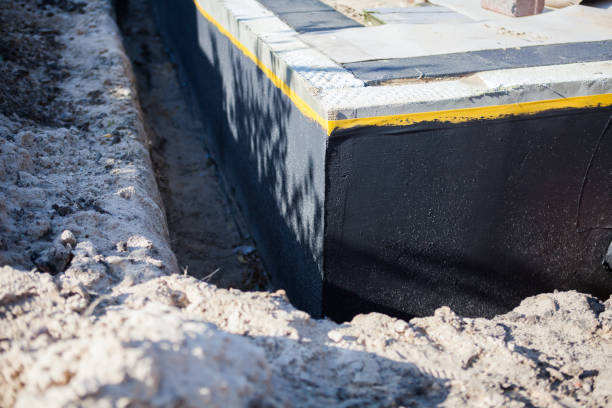 Professional Waterproofing technician working in Garden City, KS